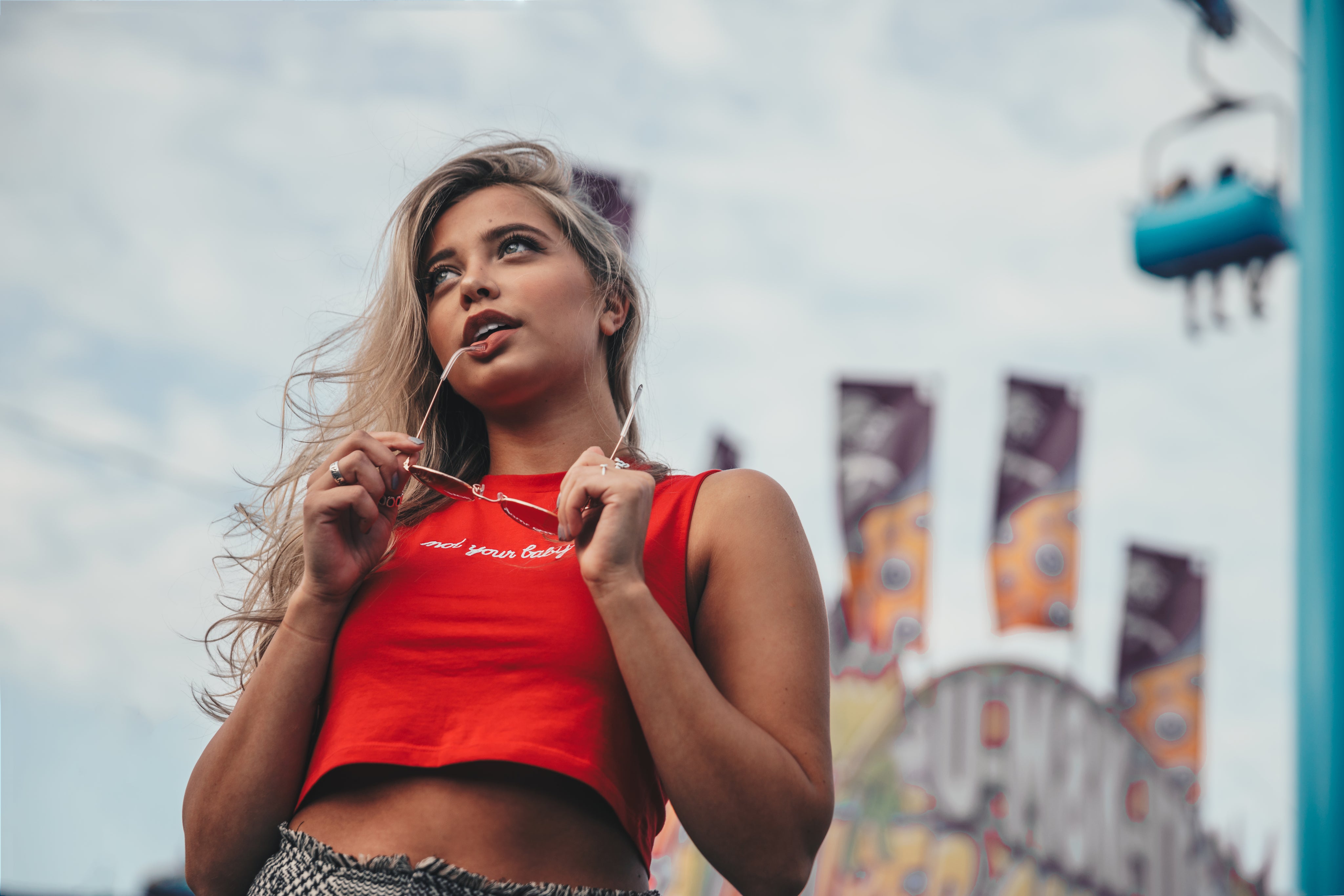 files/young-woman-holding-sunglasses.jpg